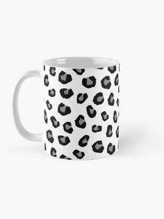 a black and white leopard print coffee mug