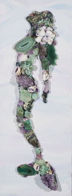 an abstract painting of a woman in green and purple colors with flowers on her body