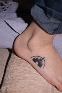 a person with a small tattoo on their foot