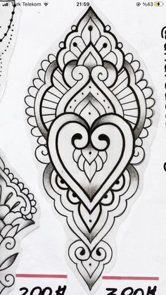 the back side of a paper with an intricate design on it, and two smaller designs in