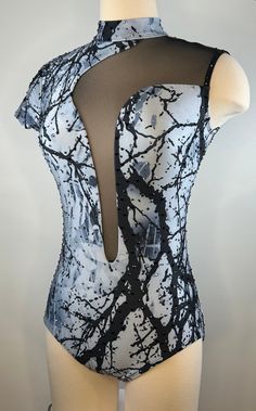 a mannequin wearing a black and white bodysuit