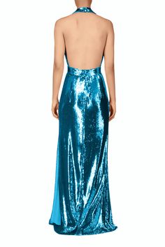 This immaculate backless gown in shimmering red sequins is incredibly eye catching. Its plunging V neck halter bodice, accented by a tailored waistband with a hand molded teal sequin flower, drapes beautifully into an elegant floor-skimming silhouette. Lined in 100% silk for ease of movement throughout the evening. This style fits true to size, we suggest taking your normal size Model wears size 2 Composition: 100% Polyester; Flower: 90% Polyester, 10% silk; Lining: 100% Silk Specialized spot clean only Made in the USA Sparkly Outfits, Backless Gown, Sequin Flower, Sequin Halter, Halter Gown, Hand Molding, Red Sequin, Flower Detail, Halter Neckline