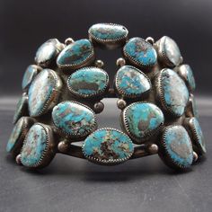 "VINTAGE NAVAJO BRACELET DESCRIPTION: This extraordinary cuff features 20 specimens of natural Blue Diamond turquoise. The high blue gemstones are secure in micro-serrated bezel, on a foundation of heavy gauge vintage sterling silver. This mesmerizing bracelet will be a cherished addition to your collection of fine vintage Native American jewelry. MEASUREMENTS: Interior of the cuff measures 5 3/4\" with an additional 1 1/8\" non-adjustable gap. Total circumference: 6 7/8\" Measures 2 1/2\" strai Blue Gemstone Cuff Bracelet, Natural Blue Diamond, Jewelry Measurements, Vintage Native American Jewelry, Navajo Bracelet, Butterfly Pictures, Vintage Navajo, Classic Jewelry, Vintage Turquoise