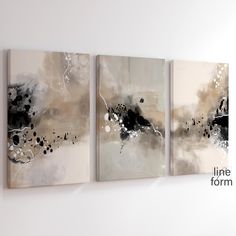 three abstract paintings hanging on the wall next to each other