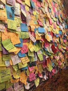 a wall covered in lots of sticky notes