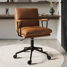 a brown leather office chair sitting on top of a white rug in front of a desk