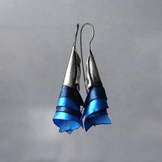 Avant garde efective earrings. They look fantastic on ear. They are made of oxidized sterling silver and silk ogranza in beatutif dark blue and blue colors. Earrings are effective and light. Enjoy colorful world of Shambala A few words about our works: All of the products in gallery are designed by us. Our studio is located in the beautiful seaside city of Gdańsk at Świętokrzyska Street. Everything is 100% handmade, with special attention to detail. In our work, you can find many collections ins Blue Sterling Silver Earrings For Evening, Artistic Blue Sterling Silver Earrings, Artistic Blue Party Earrings, Handmade Blue Evening Earrings, Handmade Blue Jewelry For Evening, Unique Blue Metal Earrings, Unique Blue Jewelry For Evening, Unique Blue Sterling Silver Earrings, Blue Sterling Silver Earrings For Party