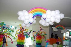 some balloons are in the shape of butterflies and rainbows