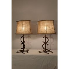 two lamps sitting next to each other on a table