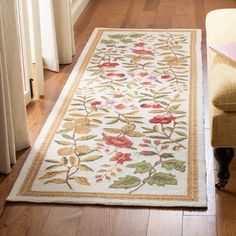 a living room with a rug on the floor