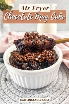 a white bowl filled with chocolate cake on top of a table