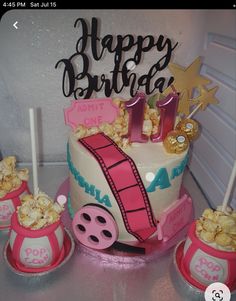 a birthday cake with pink and white decorations