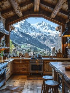 a kitchen with mountains in the background and wooden flooring, an oven, counter tops, and stools