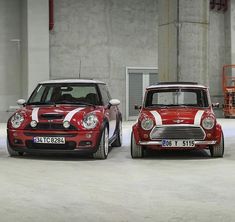 two red and white mini cars parked next to each other