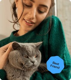 a woman holding a grey cat with the caption'best friend'in front of her