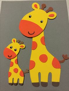 two giraffes are standing next to each other on a gray background with orange spots