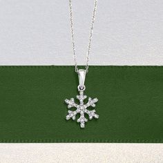 Ross-Simons - .10ct t. w. Diamond Snowflake Pendant Necklace in 14kt White Gold. 18". Chilly and chic, this icy snowflake pendant necklace glistens with .10 ct. t. w. diamond rounds in polished 14kt white gold. Perfect for winter enthusiasts to keep their favorite season at top of mind! Suspends from a rope chain. Springring clasp, diamond snowflake pendant necklace. Diamond birthstones are the perfect gift for April birthdays. Pendant Necklace Diamond, April Birthday, Snowflake Pendant, Diamond Birthstone, Necklace Diamond, Favorite Season, Rope Chain, Fine Jewelry, White Gold