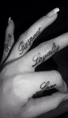 two people with matching tattoos on their fingers