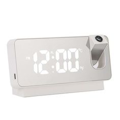 an alarm clock with the time displayed on it's display stand, in front of a white background