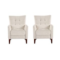 a pair of white chairs sitting next to each other