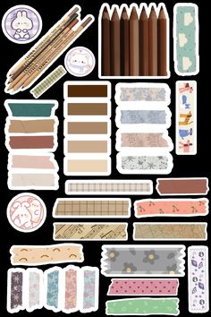 various stickers and papers are arranged on a black background