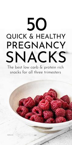 a white bowl filled with raspberries on top of a wooden table next to the words 50 quick and healthy pregancy snacks