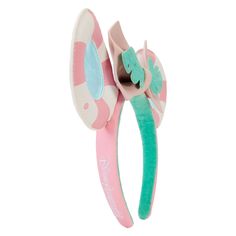 Dreaming of the perfect vacay? Check-in for your next getaway with the Loungefly Minnie Mouse Vacation Style Ear Headband. Bask in the sunshine with die-cut ears in the shape of pool floaties – you’ll even see daylight reflect off the water in the center of each ear! A tropical leaf cinches the headband’s pastel pink bow, which can be removed to accommodate personal style preferences. This accessory adds an air of relaxation to any outing and will keep you looking stylish throughout your stay.Die-cut headband is made of vegan leather (polyurethane). Additional features include applique, PVC, detachable 3D bow, and printed details. An embroidered Loungefly logo appears on the side of the band.This headband is an officially licensed Disney product.One size fits most.Headband dimensions: 8.85 Pool Floaties, Accessories Ear, Style Headband, Stylish Headbands, Leather Headbands, Pvc Panels, Ears Headband, Loungefly Disney, Minnie Mouse Ears