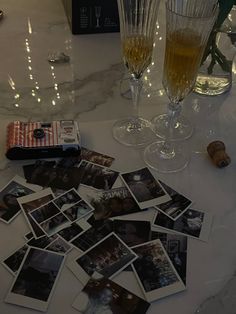 wine glasses and photographs on a table