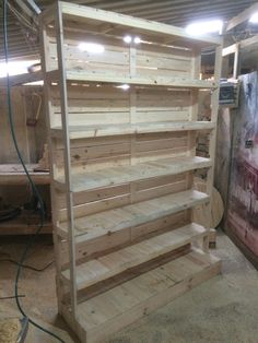 the shelves are made out of pallets and have been assembled to look like wood