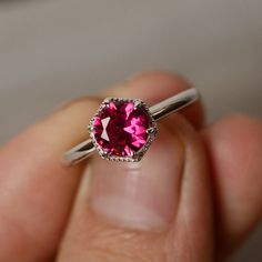 This is a gorgeous handmade creation. Its beauty is its simplicity & Elegance. The 7mm round cut Lab ruby is crafted in solid sterling silver and with rhodium plated. All item is sent in a beautiful gift box You can realize more lovely stuff clicking the link https://www.etsy.com/shop/knightjewelry?refshopsection_shophome_leftnav Please leave the correct address and you phone number for delivering successfully. 14k White Gold Ruby Ring With Halo Setting, White Gold Ruby Ring In Platinum, White Gold Ruby Ring With Center Stone, Brilliant Round Cut Lab-created Ruby Jewelry, Elegant Sterling Silver Halo Ring, 14k White Gold Gemstone Rings, 14k White Gold Ruby Ring With Brilliant Cut, Elegant White Gold Ruby Ring, Silver Solitaire Ruby Promise Ring