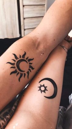 two people with sun and moon tattoos on their legs