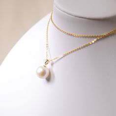 Very rare large size Edison pearl, 12mm-13mm, in perfect condition: no blemish, very high luster in perfect round shape. This pearl pendant is made of the highest quality thick 18K gold and paired with 14k vermeil silver chain. ONLY ONE available! Get it before it's gone! Pearl Type: Freshwater Edison Pearls Pearl Quality: AAAA [Shape]: Perfect Round Pearl [Pearl Size]: 12-13mm [Blemish]: None [Luster]: Very High Necklace Length: adjustable to 45cm Metal Material: Thick 18k Gold Chain Material: 14k Gold Pearl Necklace With Round Pendant, Yellow Gold Round Pearl Necklace, Yellow Gold Pear-shaped Pearl Necklace, Yellow Gold Pearl Drop Necklace With Round Pendant, Yellow Gold Pearl Drop Necklace, Edison Pearls, 18k Gold Chain, Pearl Types, Pearl Size