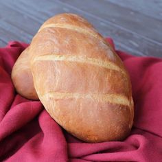 a loaf of bread sitting on top of a red cloth