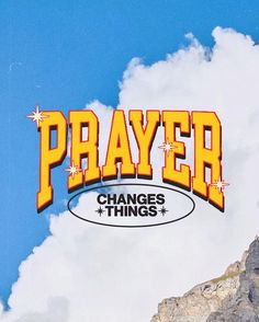 the words prayer change things against a blue sky with clouds and mountains in the background