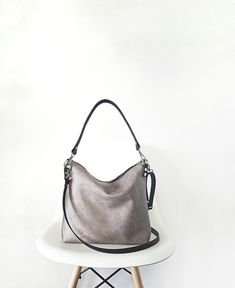 Medium/ large hobo style bag The body of the bag is made of high quality faux vegan leather in rustic distressed in light gray color. (Also available in black and brown). It is fully lined with cotton fabric black * two inner slip pockets perfect for phone, keys, cardholder etc. *Metal zipper closure *the shoulder strap and the crossbody strap (if added) are made of cowhide leather for extra support * additional crossbody strap can be added (please choose the option from the dropdown menu) *silv Rectangular Gray Hobo Bag For Daily Use, Gray Rectangular Hobo Bag For Daily Use, Crossbody Hobo Bag For Errands, Crossbody Hobo Bag With Single Shoulder Strap For Errands, Gray Large Capacity Hobo Bag For Daily Use, Trendy Large Capacity Gray Hobo Bag, Trendy Gray Large Capacity Hobo Bag, Gray Tote Shoulder Bag With Adjustable Strap, Trendy Hobo Bag For On-the-go