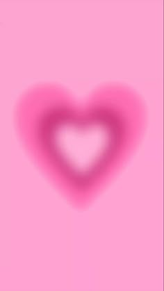 a heart shaped object on a pink background