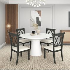 a white table with four chairs around it in a room that has carpeted flooring