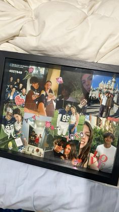 a collage of photos is displayed in a frame on a bed with white sheets