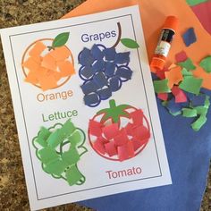 an orange, lettuce, tomato and grape craft