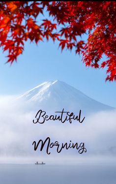 the words beautiful morning are in front of an image of a mountain with red leaves