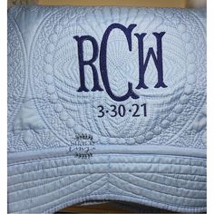 the back side of a quilted pillow that reads rck, 350 - 21