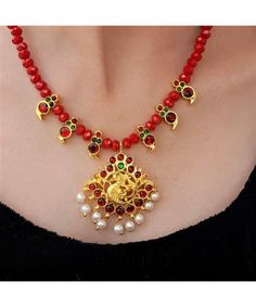 Product Description :  Handmade High quality Gold plated Maroon Kemp Annapakshi Pendant with Maroon Kemp Mango motif and Red Crystal beads Necklace Set with adjustable dori for perfect fitting. A perfect choice for your jewellery collection. Suitable for Wedding, ethnic wear, festive and party wear. A beautiful gift for your loved ones. This product is especially handmade for you after receiving the order and takes 4 to 5 man hours to complete, hence slight imperfections are expected which is not a defect.  Slight color variation of the product may occur due to photographic light effect. Necklace Weight : 40 gms Dimensions : Necklace Length (w/o dori) - 21 cm, Dori Length - 26 cm, Pendant Height - 5 cm , Pendant Width - 4 cm Earring Height - 1.5 cm, Earring Width - 0.7 cm Material : Alloy Festive Red Peacock Design Necklace, Red Temple Jewelry Necklace With Peacock Design, Red Peacock Design Temple Jewelry Necklace, Red Temple Jewelry Necklace For Diwali, Red Kundan Necklace With Round Beads In Temple Style, Red Beaded Kundan Necklace In Temple Style, Red Kundan Temple Necklace For Festivals, Red Kundan Temple Necklace For Diwali, Festive Red Temple Jewelry Necklaces