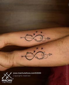 two people with matching tattoos on their arms, one has an arrow and the other has a name