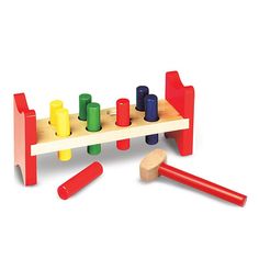 a wooden toy with colorful pegs next to it