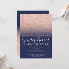 a blue and pink ombreed gender reveal baby shower card with gold glitter on it