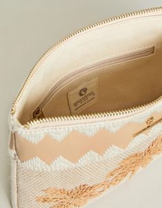 For its petite size, our papyrus embroidered palm beach, woven jute Maci Wristlet certainly get its share of attention thanks to its gorgeous details: a double-tassel statement fob, an embroidered woven band and a faux leather braided wristlet strap. The interior has plenty of space to hold your essentials. Faux leather wristlet strap & embroidered band along top of the wristlet Hanging two-tiered tassel fob Interior features: zipper pocket along the back panel Dimensions: 8.875'' W; 6.5'' H; 1.75'' Materials: Embroidery on cotton/jute with faux leather accents Custom crosshatch patterned cotton interior Washing Instructions: Spot clean with a cloth, slightly dampened with warm water Spartina 449, Leather Wristlet, Petite Size, Wooden Beads, Palm Beach, Warm Water, Zipper Pocket, Faux Leather, Band