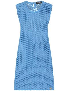 a women's blue dress with holes on the front and back, made from knitted fabric