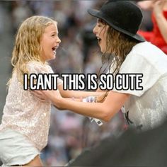 two women are talking to each other while one is holding her arm around the other