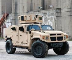 an armored vehicle parked in front of a building