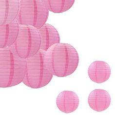 pink paper lanterns floating in the air on a white background with five smaller ones below them